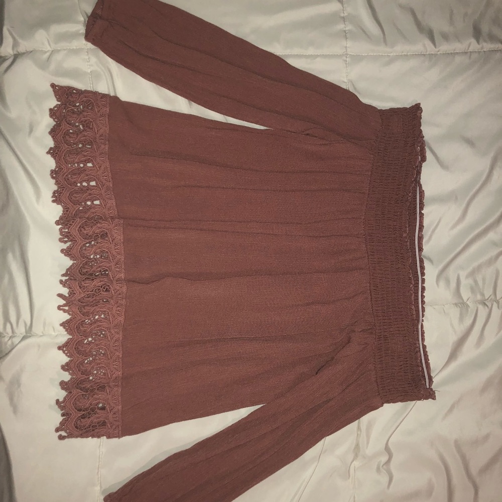 Off the shoulder pink blouse.